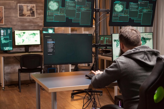 shot-from-back-dangerous-hacker-making-dangerous-virus-identity-theft_482257-34244